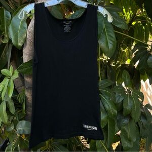 True Religion black ribbed tank top with a silver logo on the bottom.